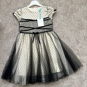 Abel and lula dress beige:black. Lined skirt. Size 7/122cm. Made in Morocco.